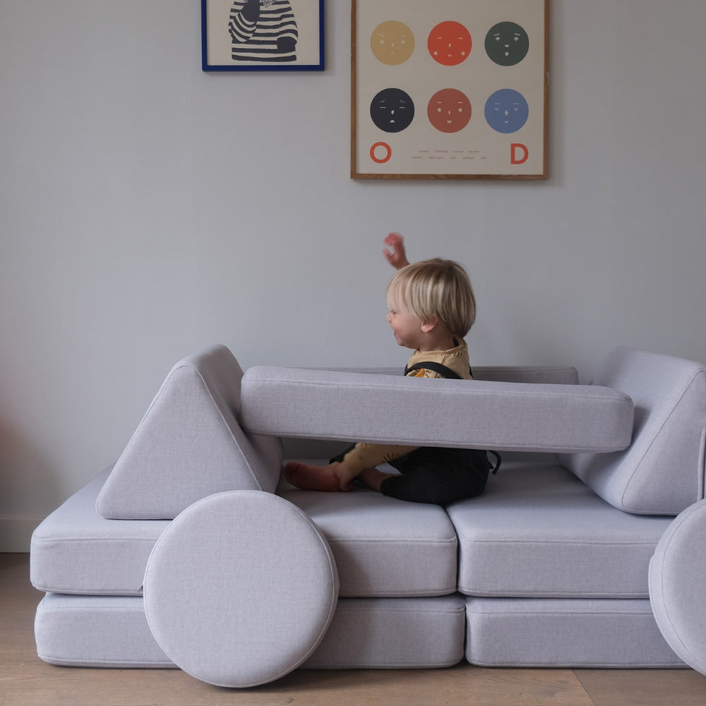 Parent and child choosing colorful Shappy modular play sofa with safe materials and stylish design