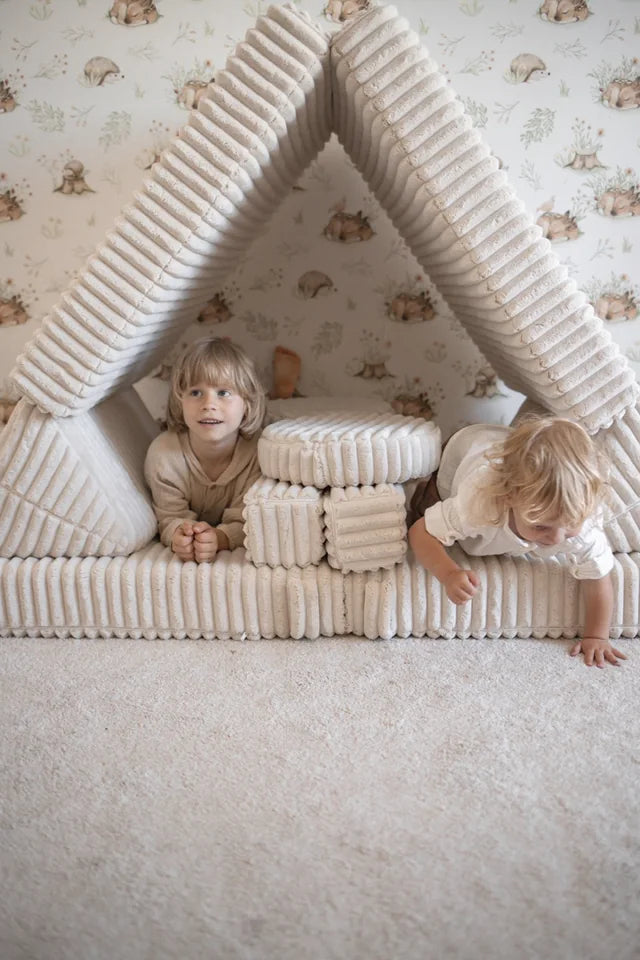 Children playing in a Waffle sofa den