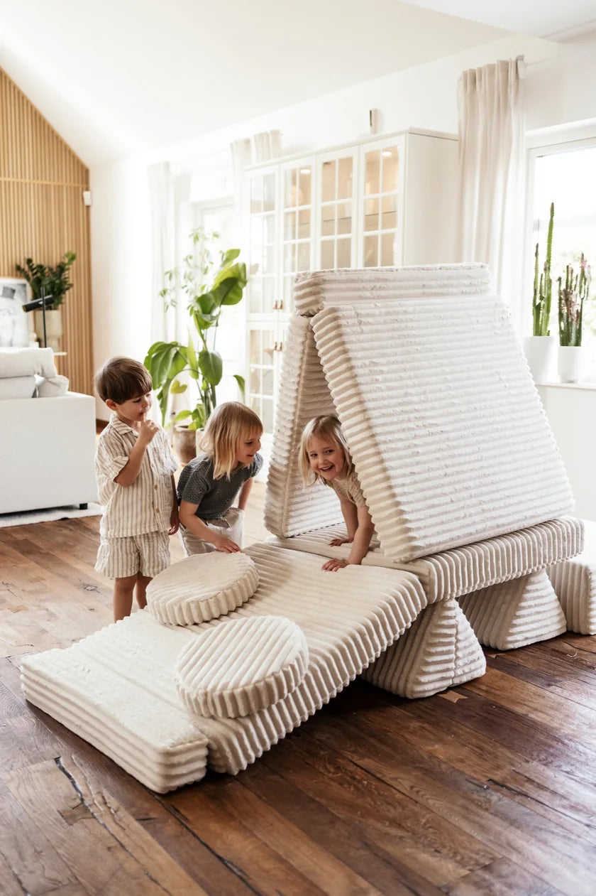 Children playing on a large ship built from Play Sofa Waffle