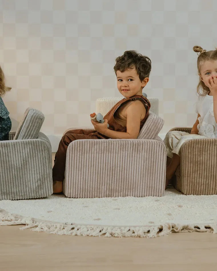 Children sitting in Lumi Chairs