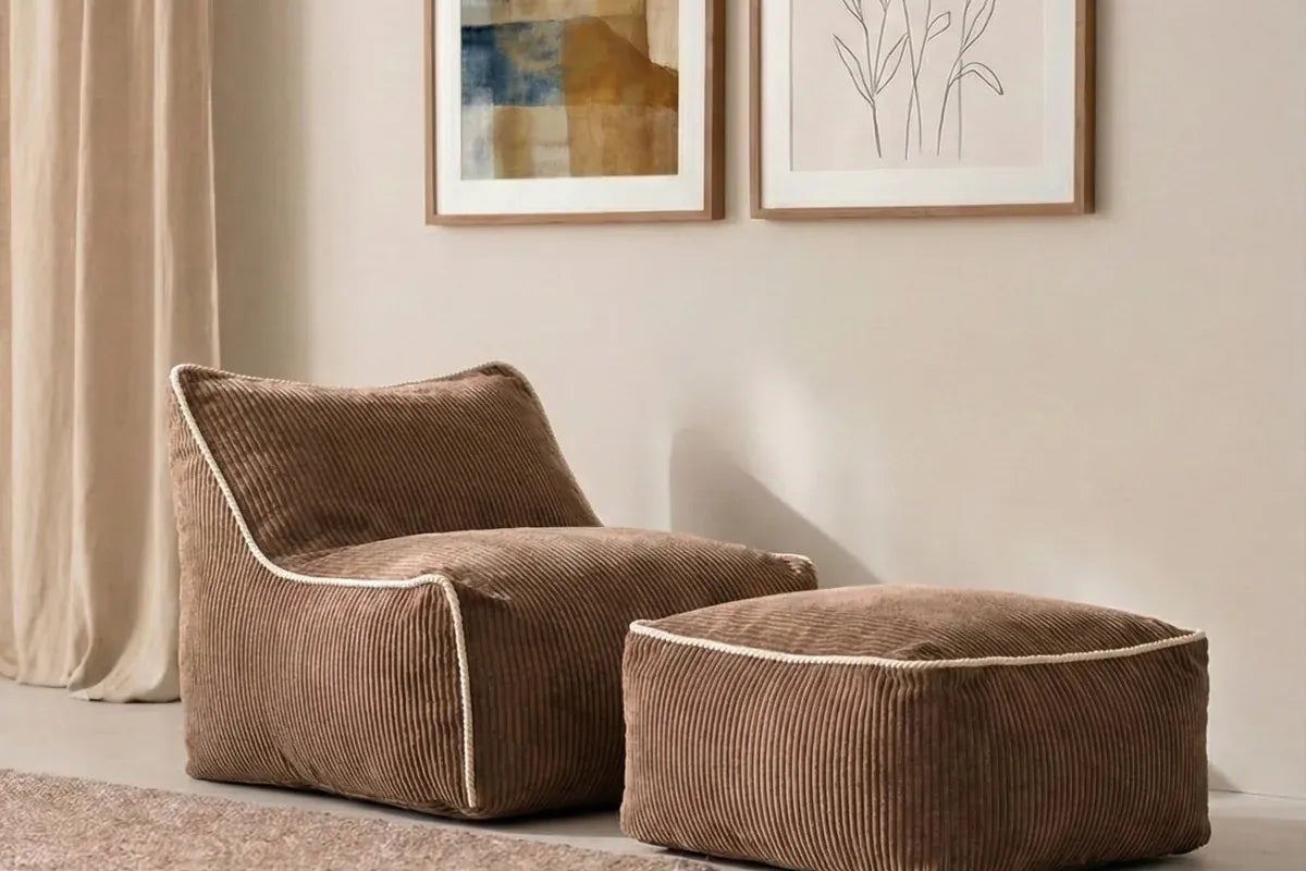 Kumo Chair and Ottoman Chocolate in a living room