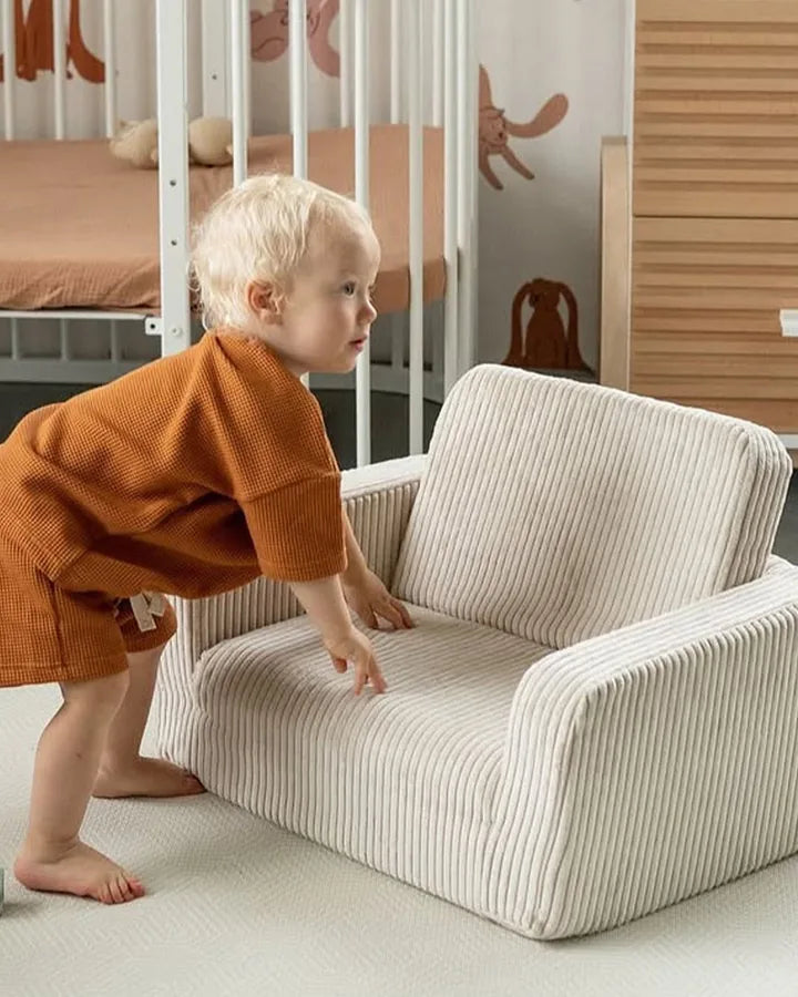 Toddler pushing Lumi Chair Corduroy in Vanilla