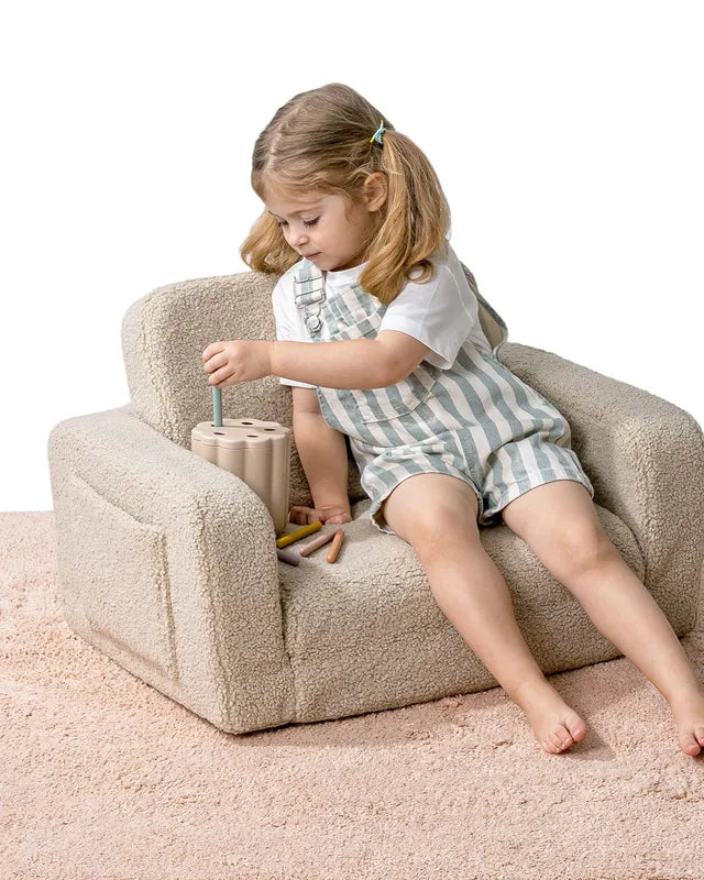 Child sitting in Lumi Chair Teddy