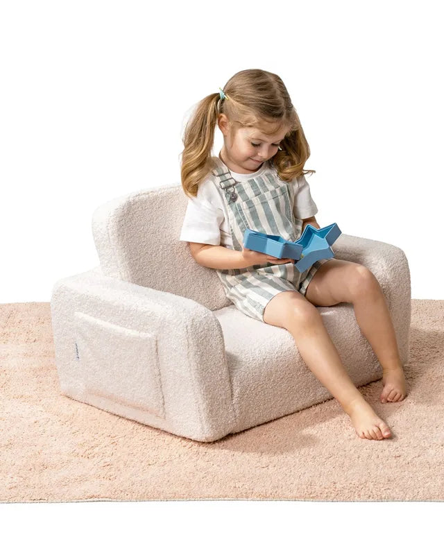 Child playing on Lumi Chair Teddy