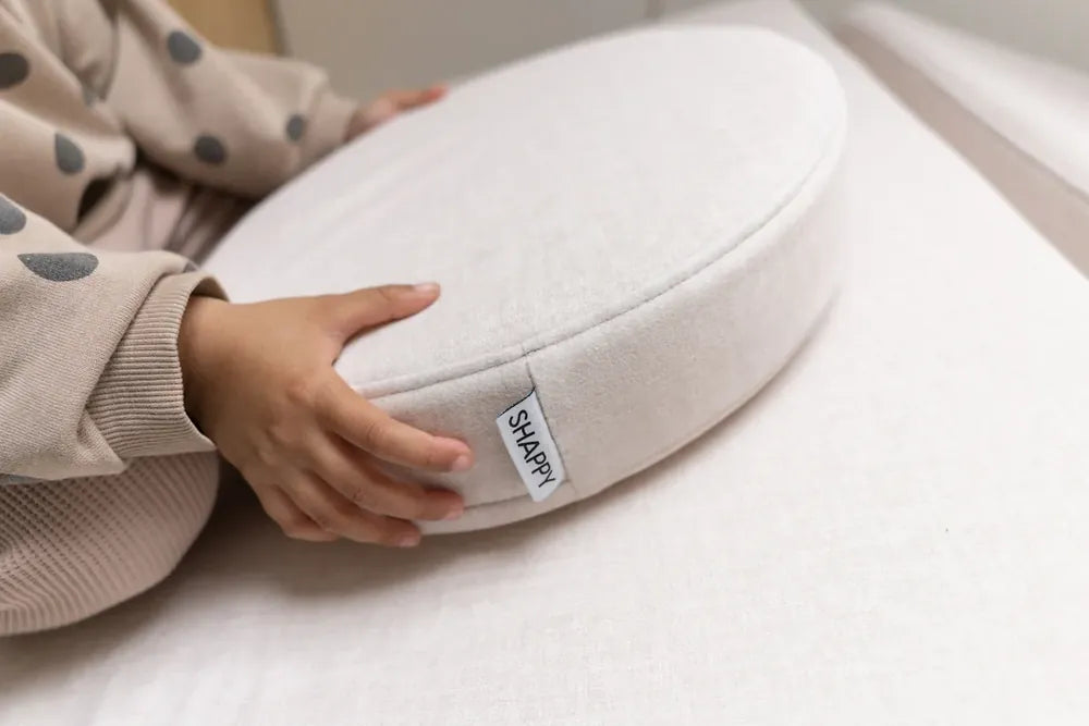 Close view of the double-stitched edge on a Play Sofa Original cushion in Soft Beige