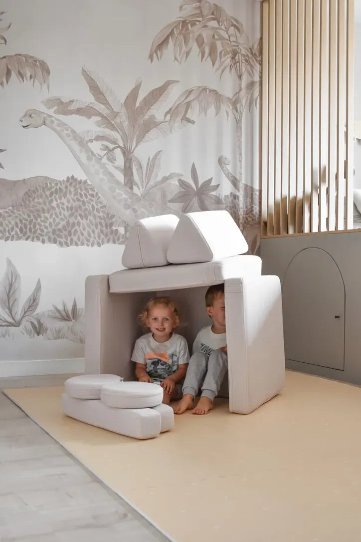 Two children in a den built from Play Sofa Original Mini in Soft Beige