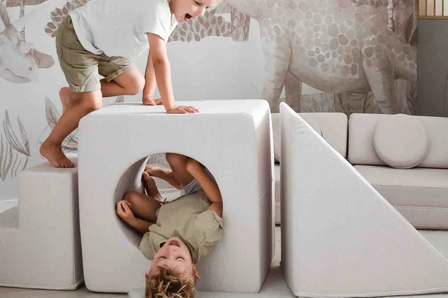 Boy crawling through the cube while another child climbs over it, Playset in Soft Beige