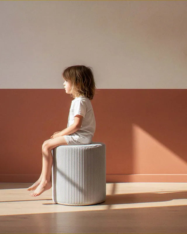 Girl sitting on Shappy Pouf Corduroy Pebble