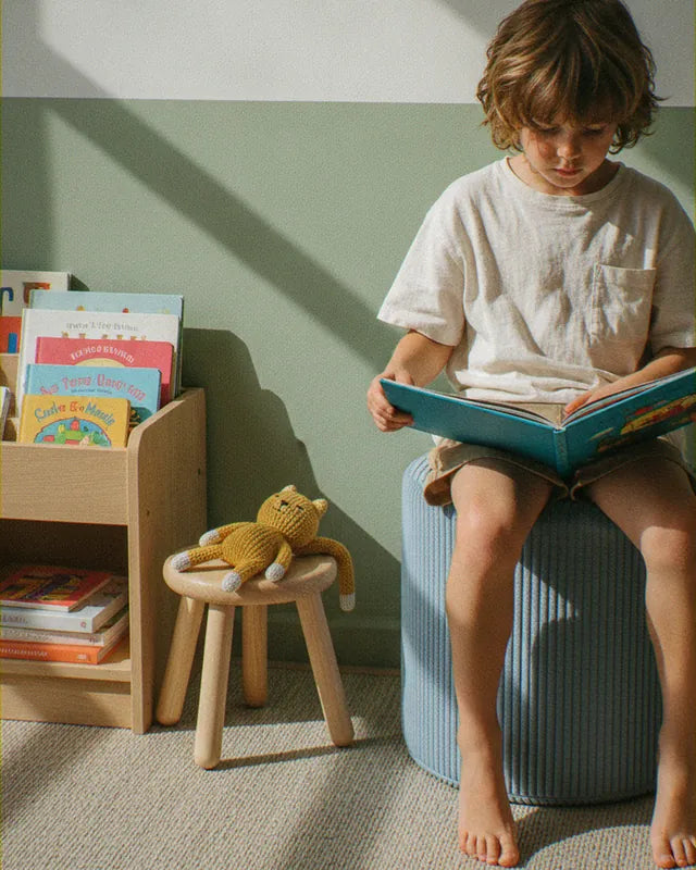 Boy reading on Shappy Pouf Corduroy Sky Sugar