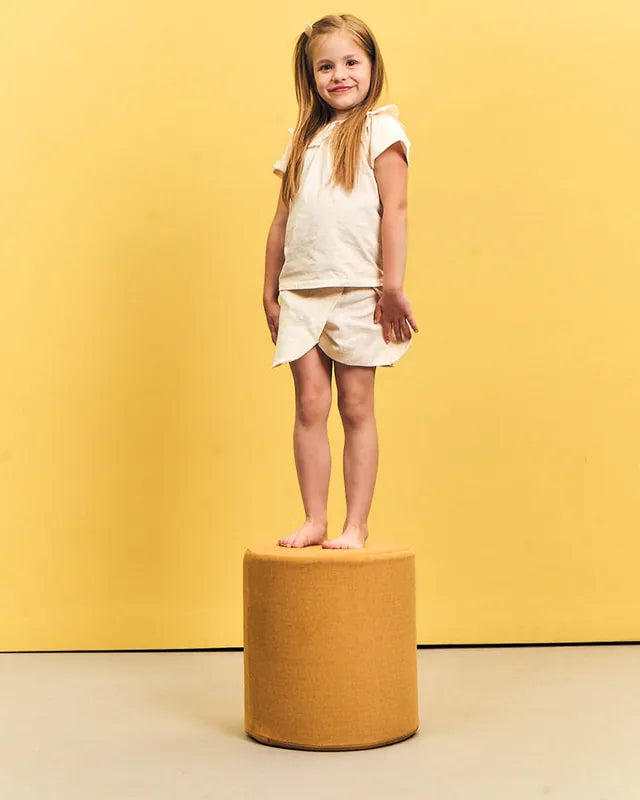 Girl standing on Shappy Pouf Ultra Plush Mustard