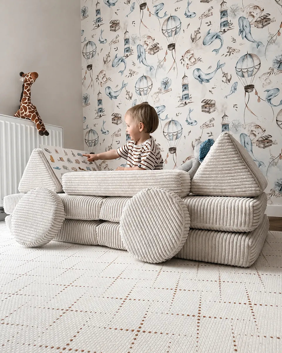 Toddler choosing a new build on Play Sofa Pure Corduroy Mini