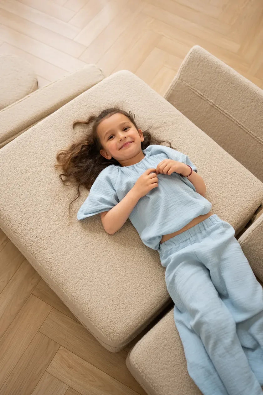 Girl lying on Play Sofa Original Teddy opened flat