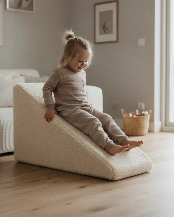Child sliding down Slide Teddy