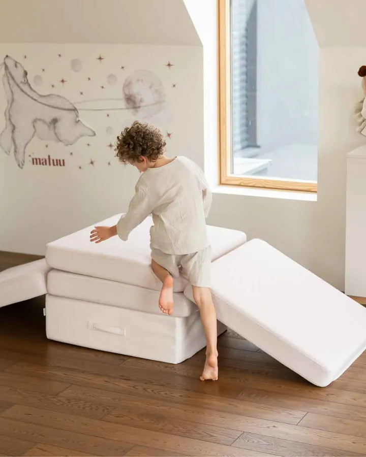 Boy building with the Trampoline and Play Sofa Original Soft Beige