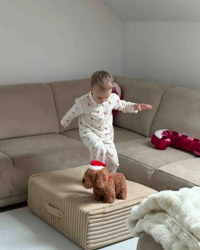 Child on Trampoline Pure Corduroy Waffle next to a sofa