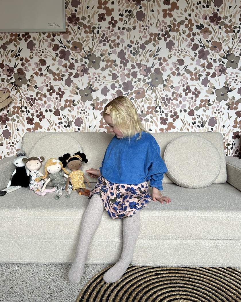 Girl sitting on Play Sofa Original Teddy put back together as a sofa