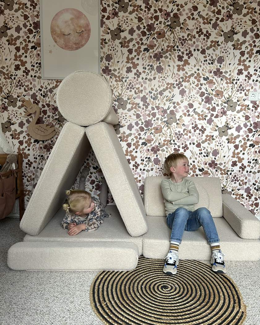 Two children by a tent built from Play Sofa Original Teddy