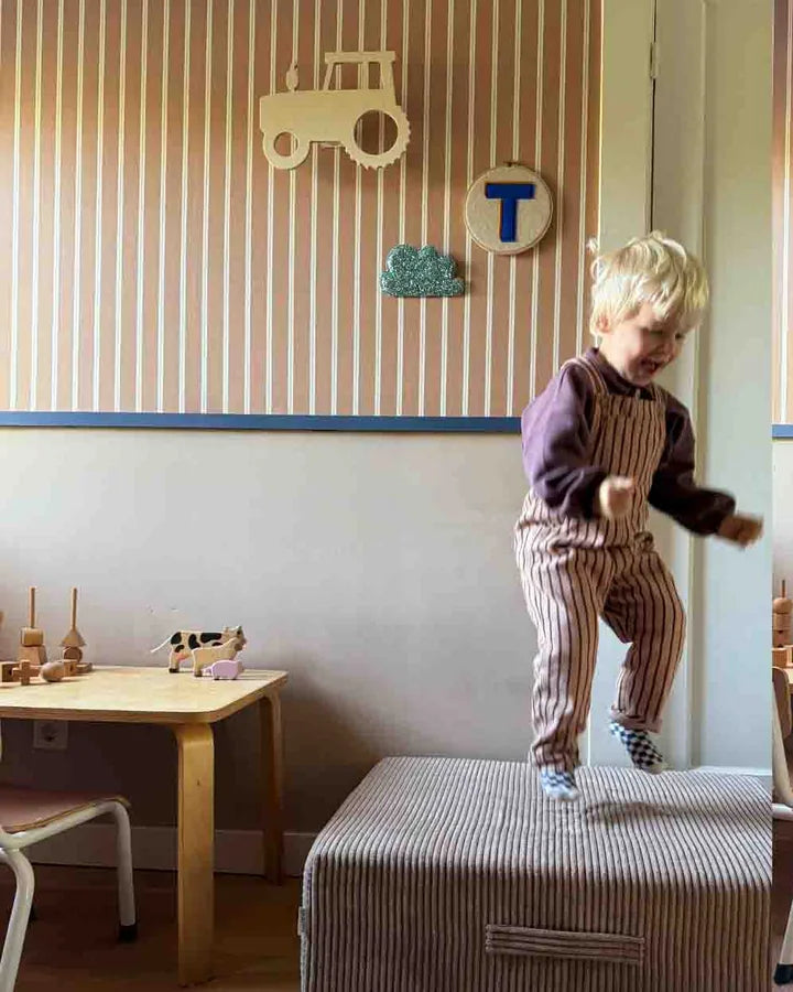 Boy jumping on the Trampoline Pure Corduroy in the playroom
