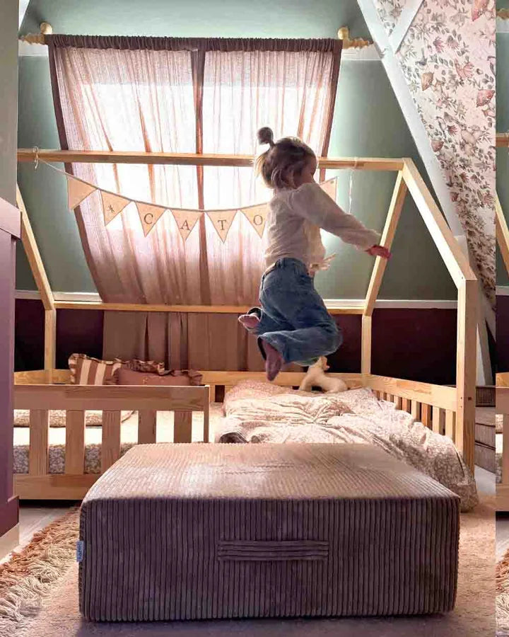 Girl jumping on the Trampoline Pure Corduroy in her bedroom