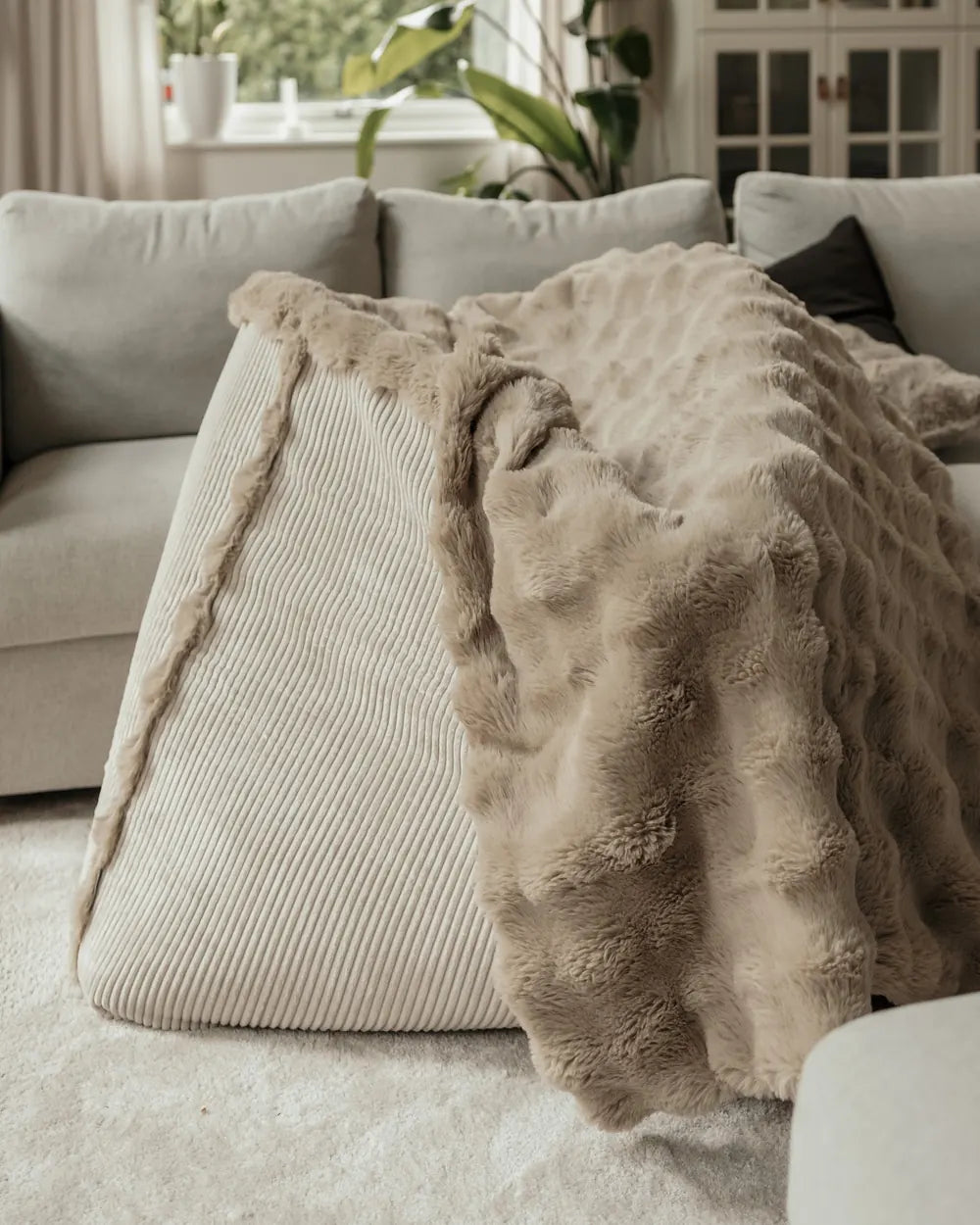 Snuggle Blanket draped over the Snuggle Bag