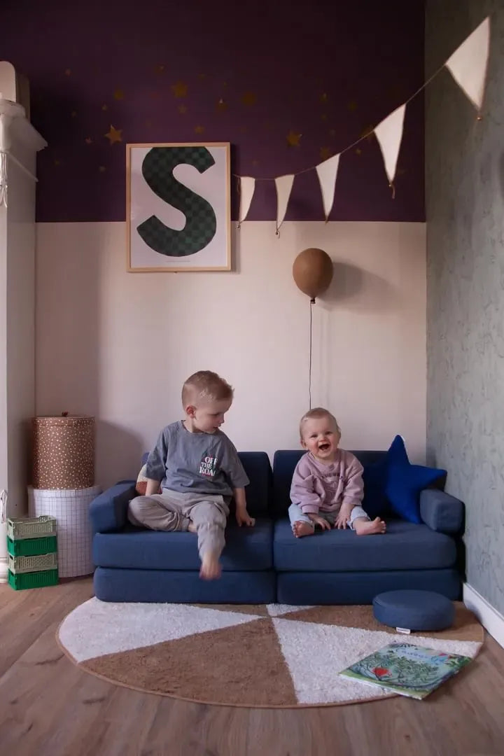 Two toddlers sitting on Play Sofa Original Mini in Navy Blue