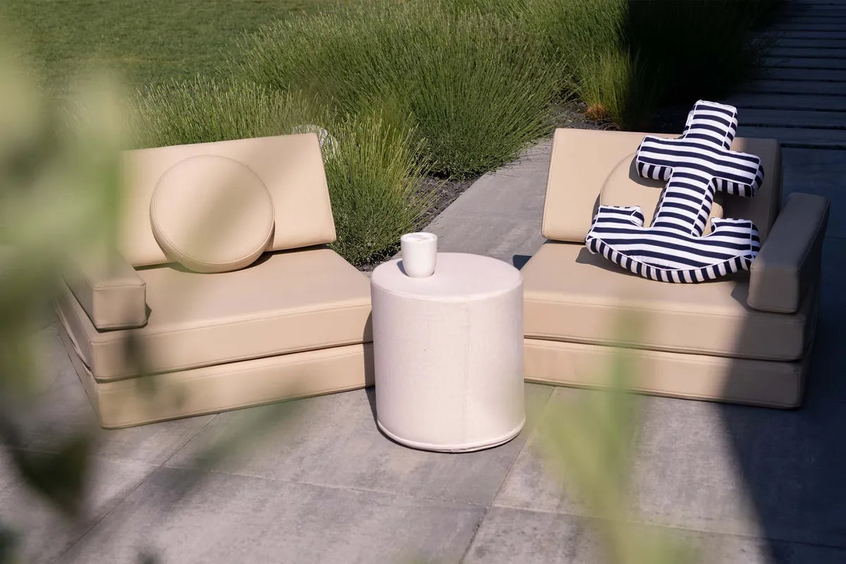 Shappy Pouf Ultra Plush next to Play Sofa pieces on a terrace