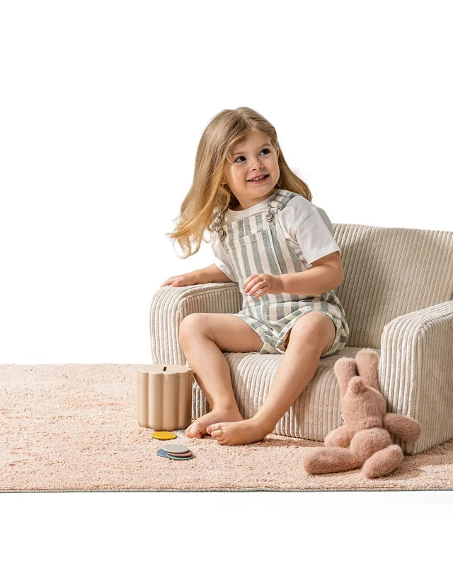 Child sitting in Lumi Chair Corduroy