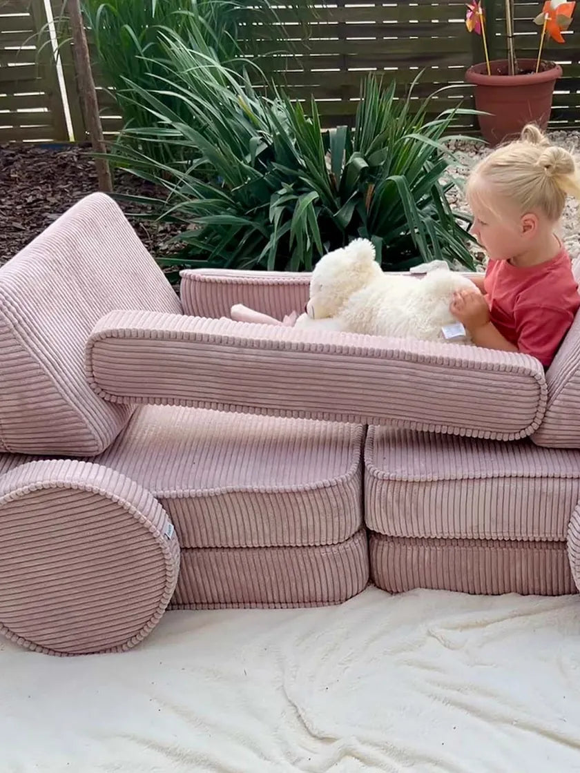 Girl playing in a car built from Play Sofa Original Corduroy in Candy