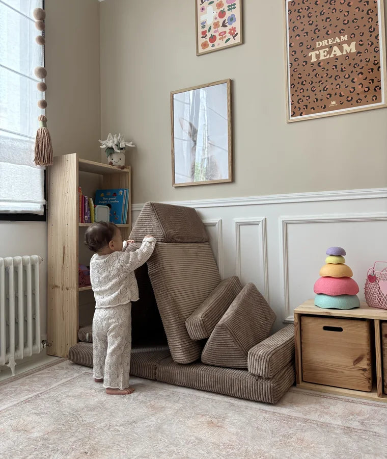 Child building a hideaway from Play Sofa Pure Corduroy Mini in Chocolate