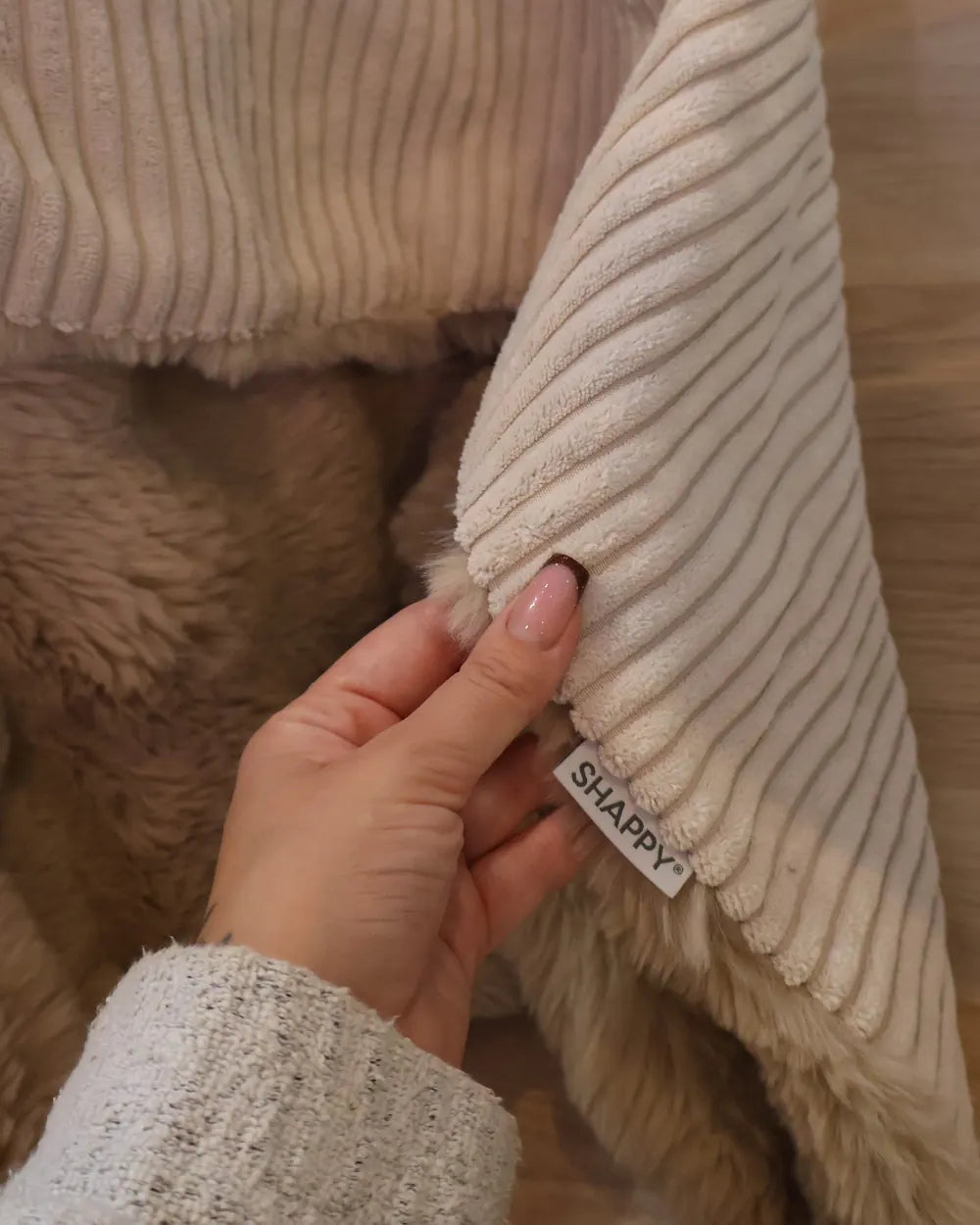 Ecke der Snuggle Blanket mit dem Shappy-Etikett