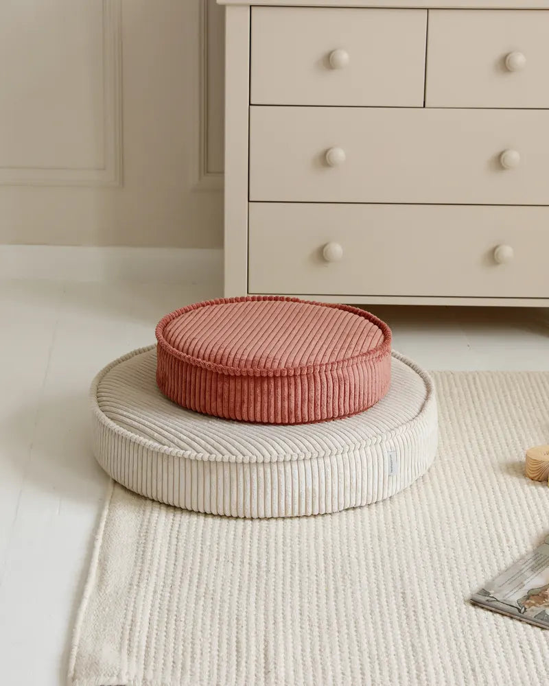 Yuka Pouf Mini in Rose stacked on a Yuka Pouf in Vanilla